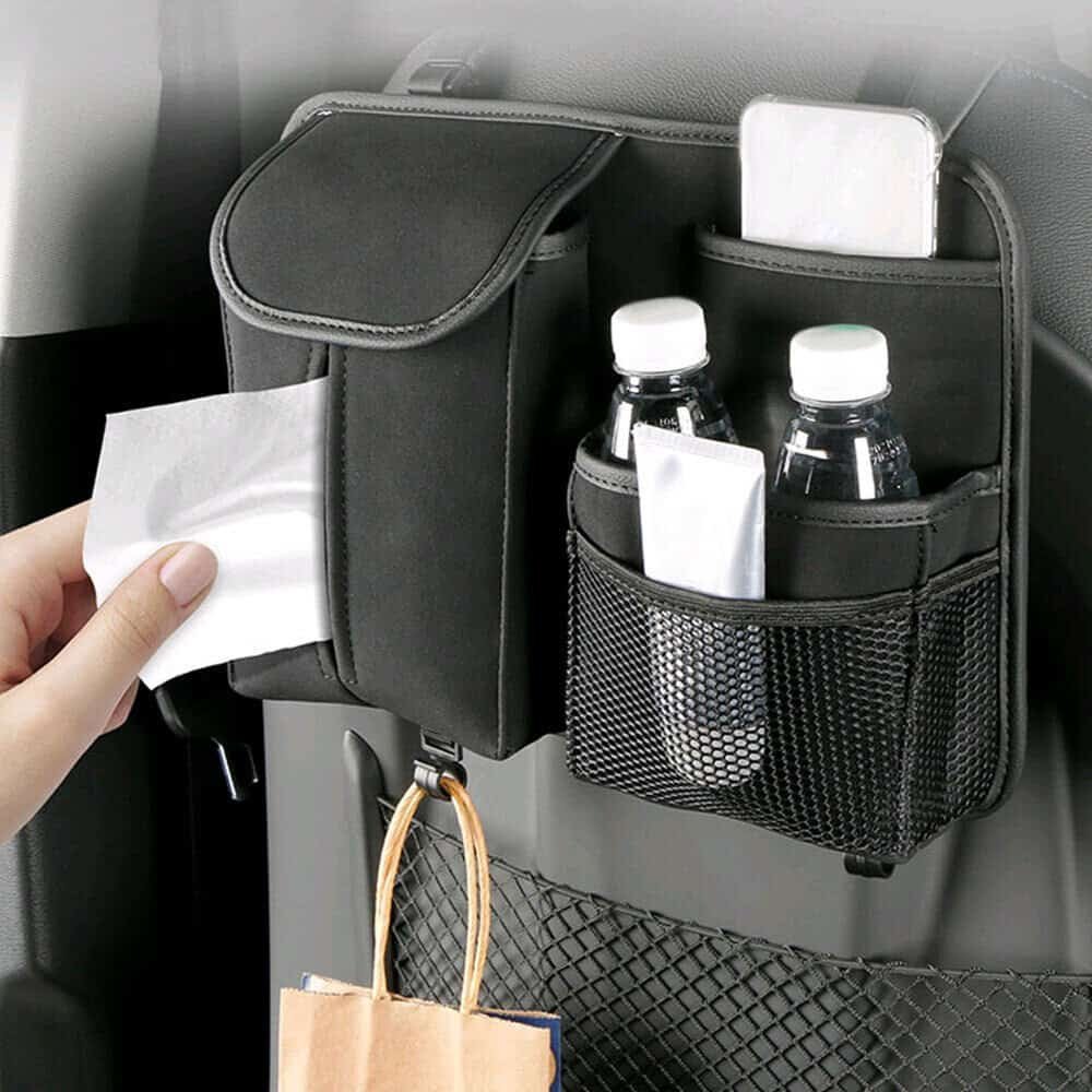 Car Back Seat Organizer holding bottles, phone, and tissues in pockets