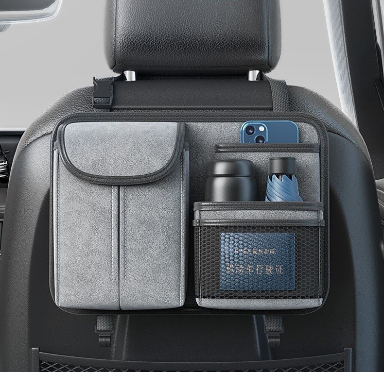 Organized car seat back pocket with phone, water bottles, and travel essentials.
