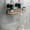 Arsi Studio vacuum suction shelf installed in modern bathroom