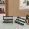 Organizing kitchen or office supplies with black metal desktop file holders.
