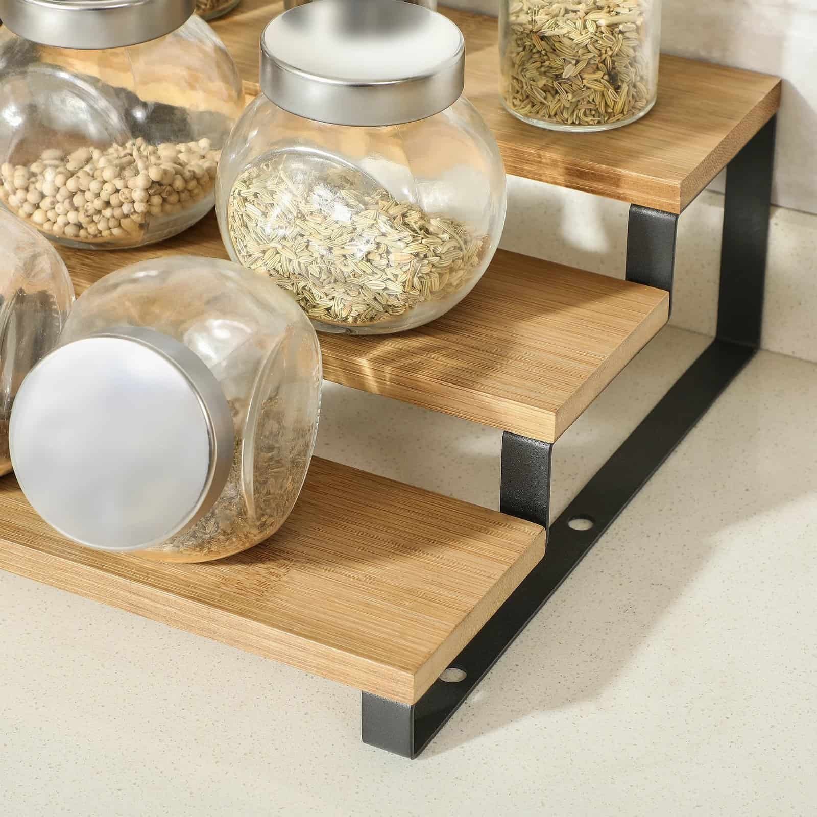 Glass jars filled with spices and grains on a wooden and metal shelf for kitchen storage, showcasing modern organization and decor.