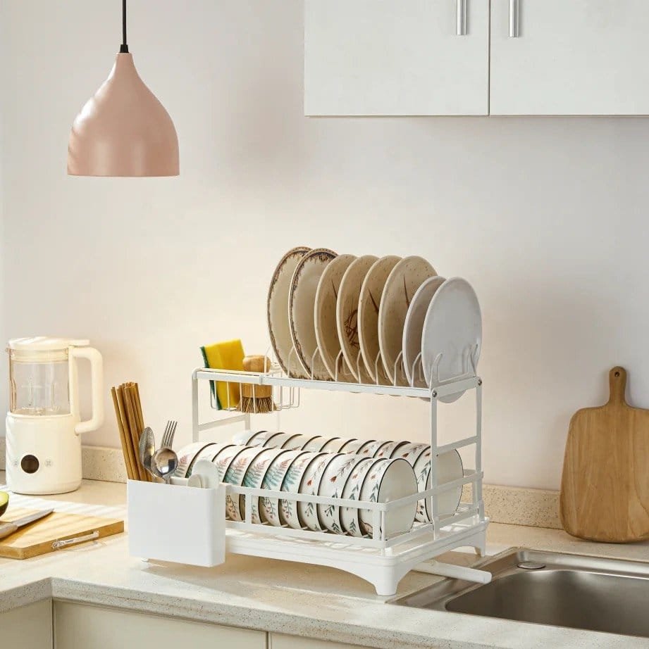 Elegant dish drying rack for kitchen, organized with plates, cups, and utensils. Modern kitchen design by Arsi Studio.