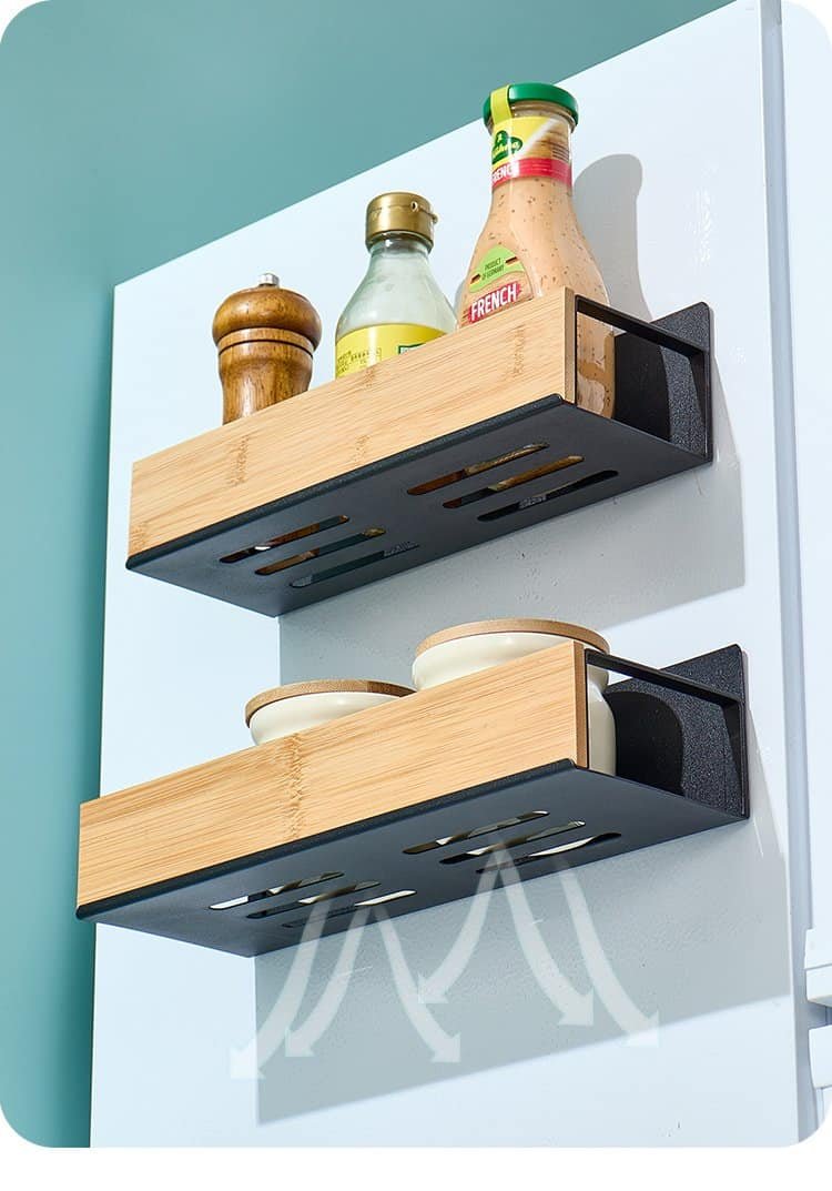 Wood and metal kitchen wall shelves with condiments and dishes, modern kitchen storage solution.