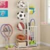 White ball rack organizer neatly storing footballs and basketballs in a modern room