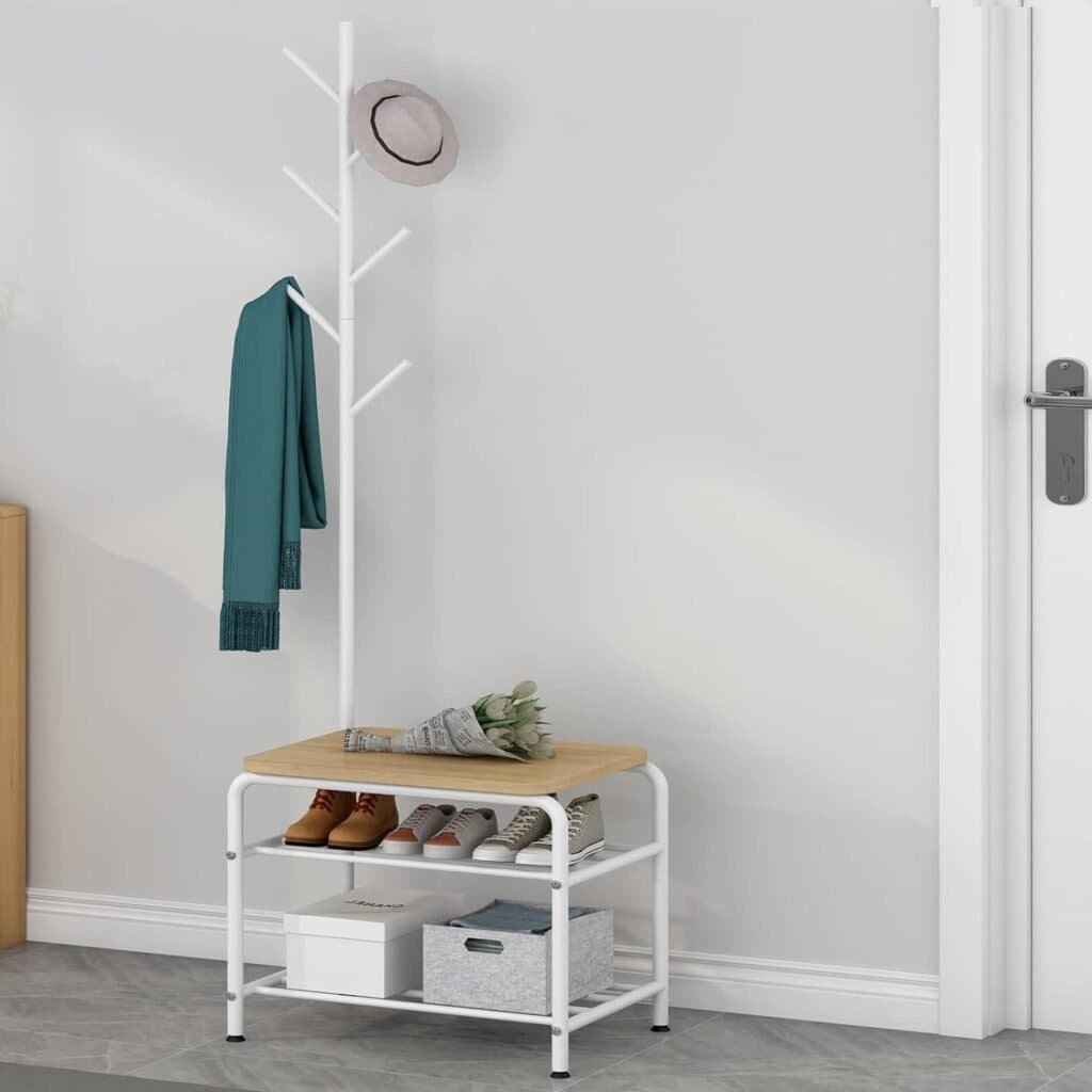 White coat rack with hat, scarf, and shoes setup for modern entryway organization.