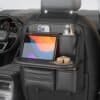 Car back seat organizer with foldable tray holding tablet and drinks – ideal for long drives.