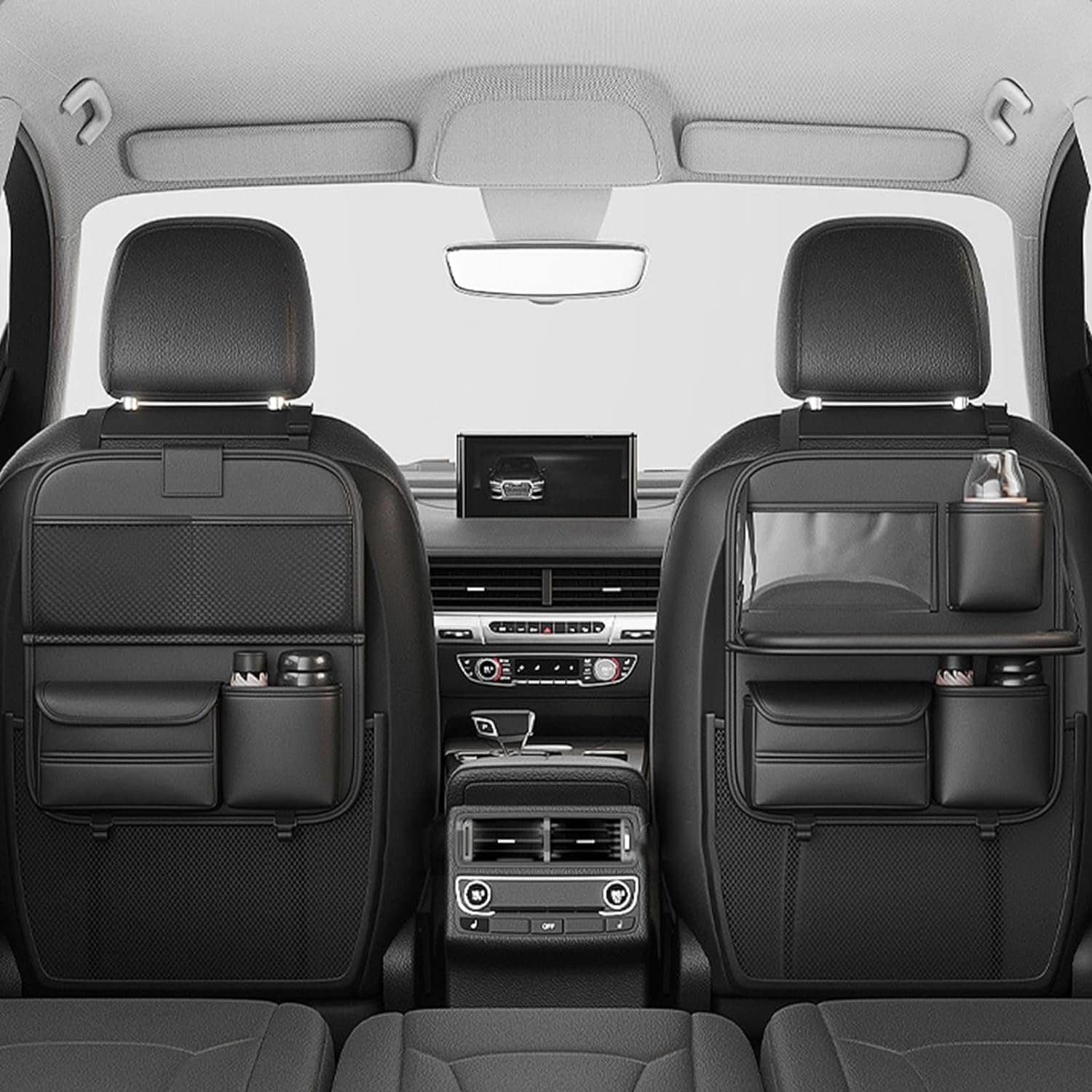 Black leather back seat organizer with cup holder, tray table, and storage pockets.