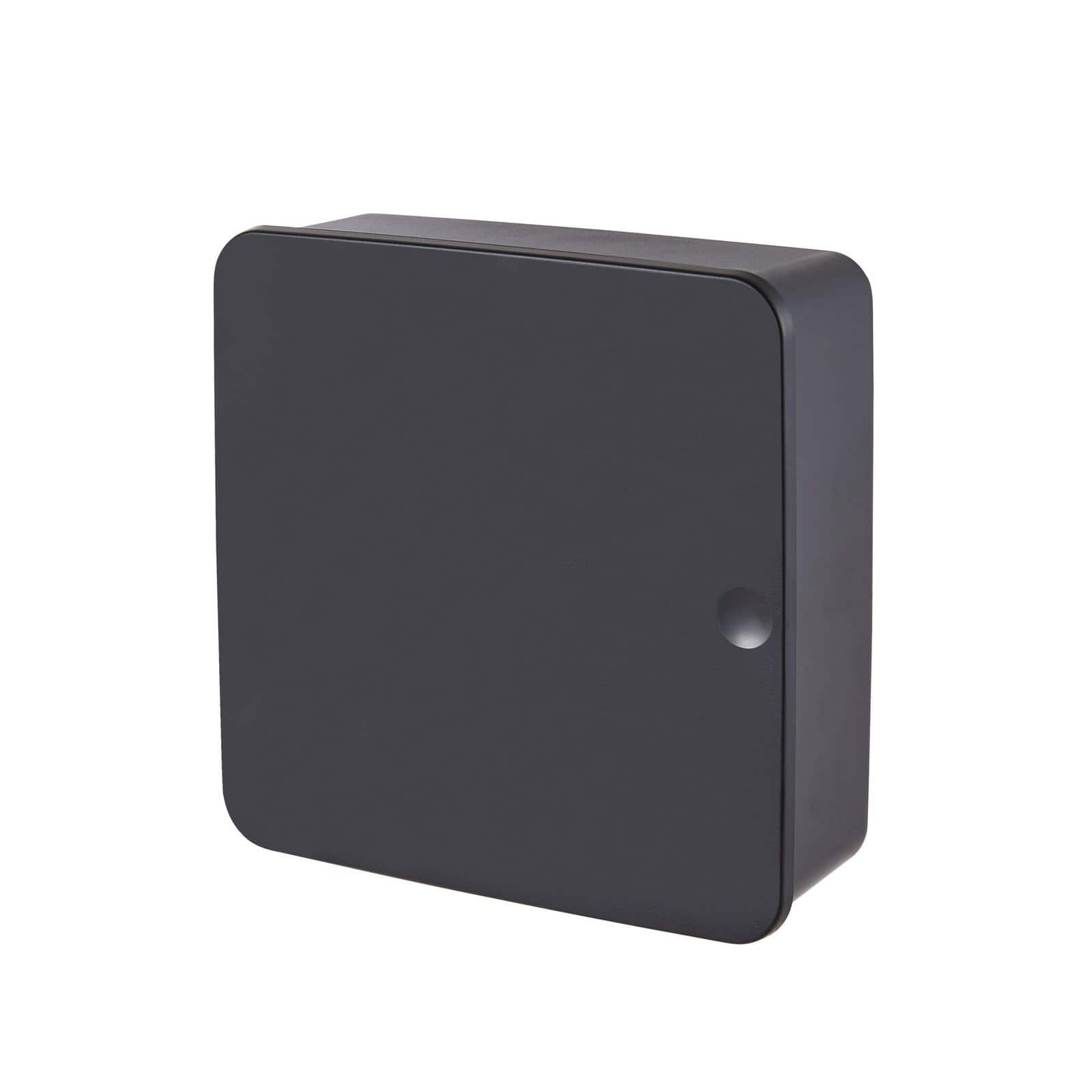 Front-facing view of the closed black key organizer with a minimalist matte finish.