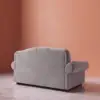 Rajford 2 seater sofa in light grey back side angle view showing rear panel and armrest design