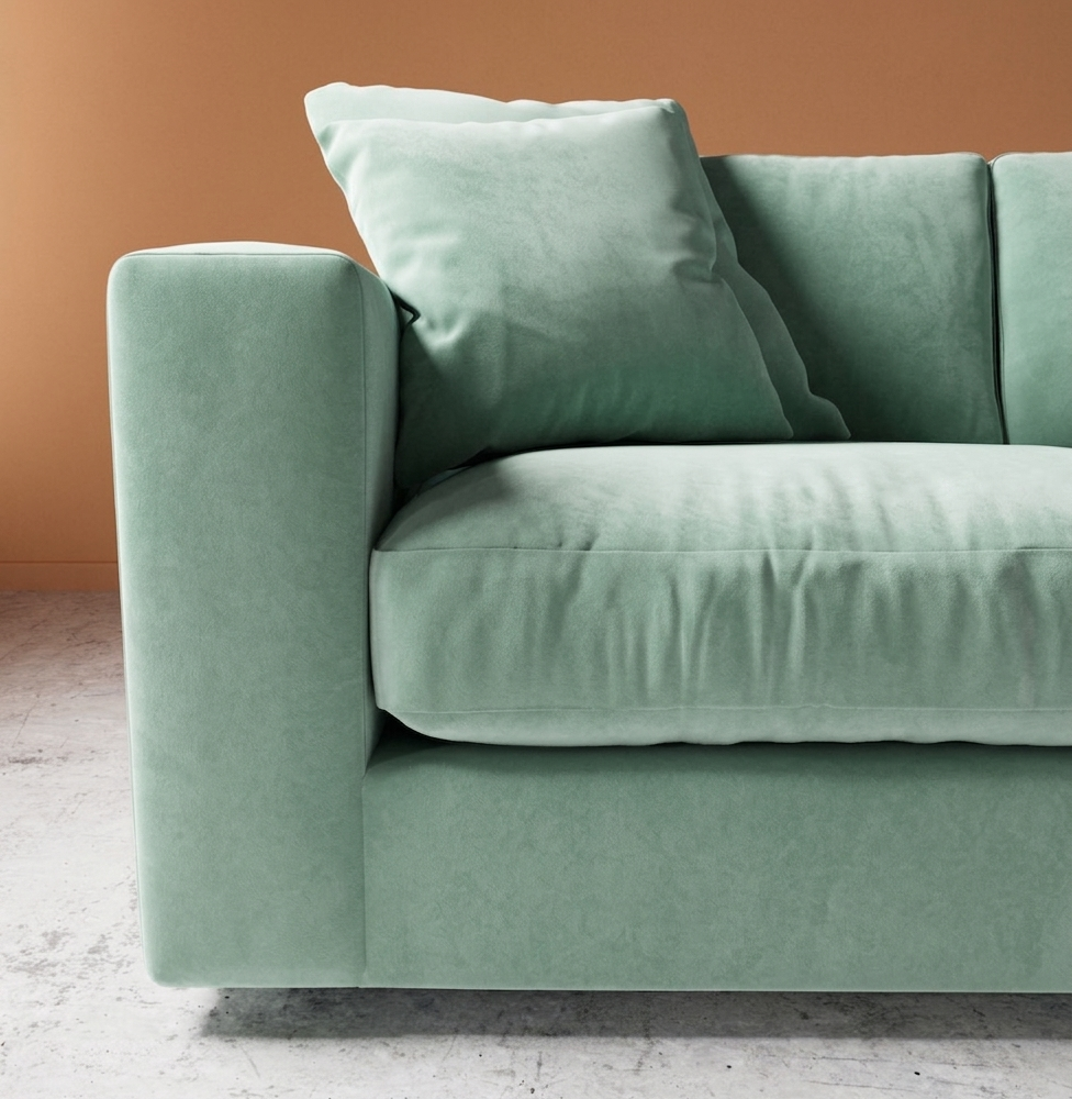 Mint green modern sofa with cushions