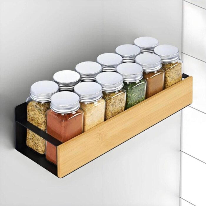 Bamboo Magnetic Rack mounted on a kitchen wall holding spice jars