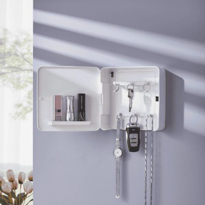 The white organizer box opened, revealing internal key hooks and shelves storing perfume and lipstick.