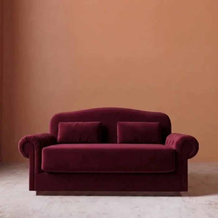 Rajford 2 seater sofa in burgundy front view with curved backrest and plush cushions